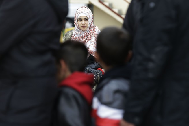 The Latest: Greece threatens to block EU summit decisions