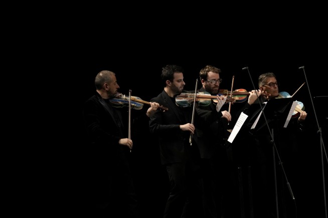 La Scala concert features violins that inmates made from battered migrant boats