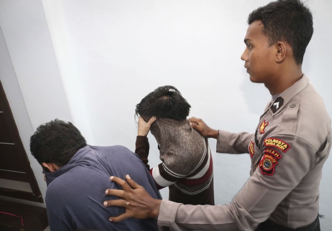 Shariah court in Indonesia sentences gay couple to caning