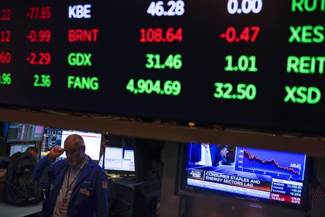 Stocks end lower, nearing but not quite in a bear market