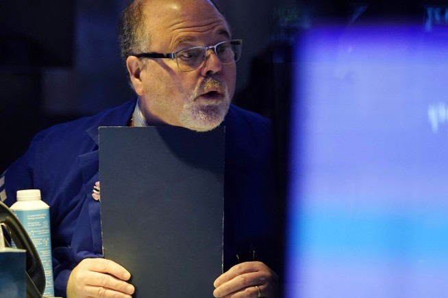 Stock market today: Wall Street finishes mixed as strong fashion, tobacco stocks offset Ford's drop