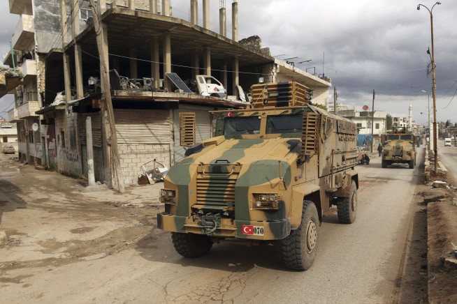 Syrian troops gain territory in push to control key highway