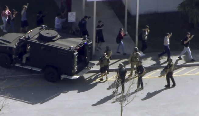 The Latest: Sheriff confirms shooter was former student, 18