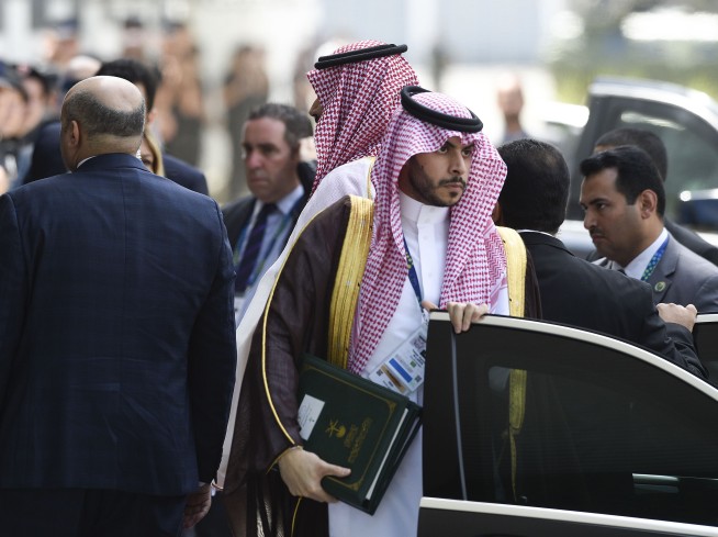 The Latest: Putin, Saudi prince share jovial greeting
