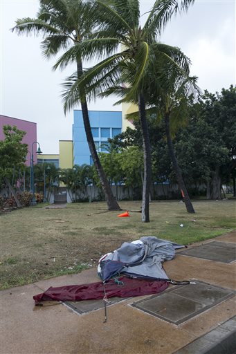 Julio down to Category 2 storm as Iselle lingers