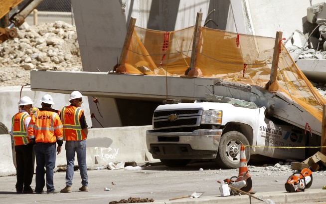 The Latest: Caller reported cracks in bridge before collapse