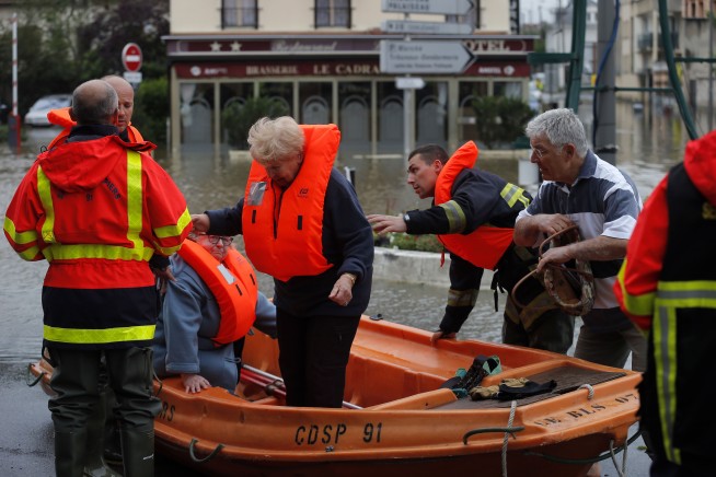 The Latest: Louvre to shut down, move art to higher floors