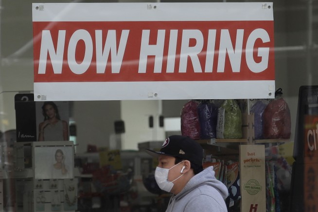 US employers add a modest 245,000 jobs as virus intensifies