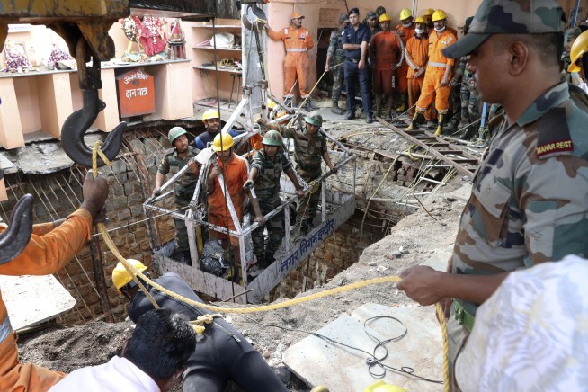 36 bodies found inside well after collapse at Indian temple