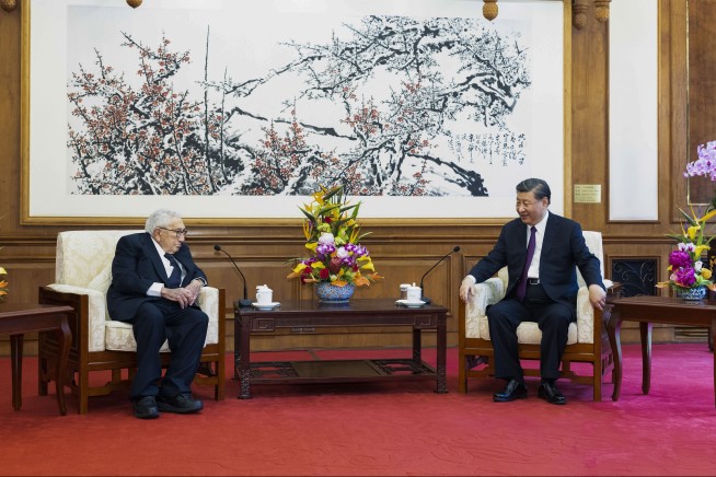 China's Xi tells Kissinger that China-US ties are at a crossroads and stability is still possible