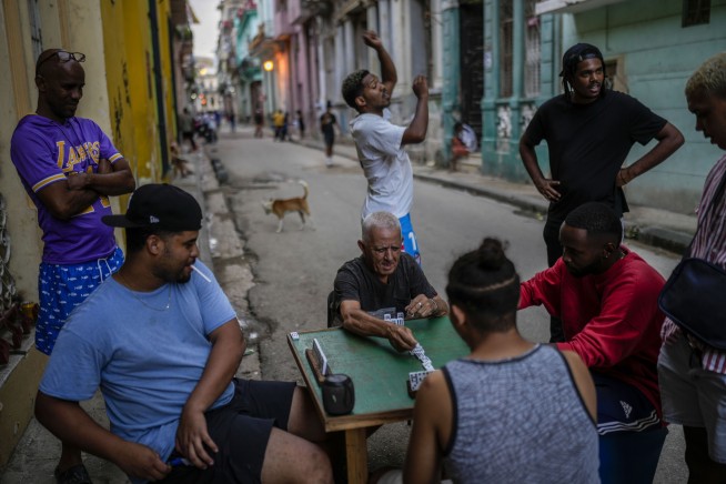 Cuba fights to come back from a nationwide blackout, then a storm that killed six