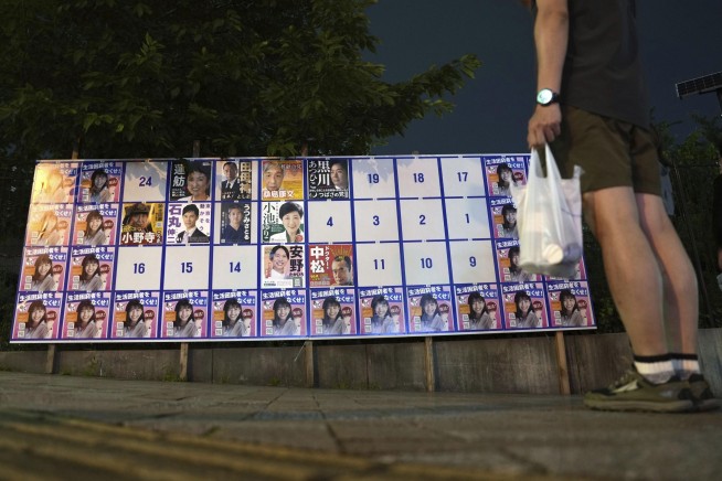 'We have to be wacky.' With suggestive poses and pets, election campaigning tests Tokyo's patience