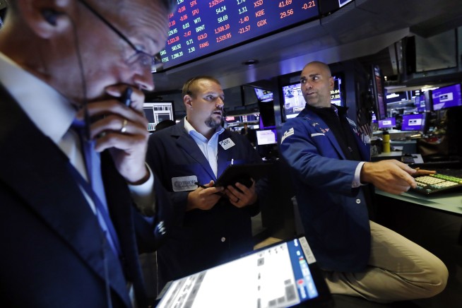 Stocks stumble on trade-war worries, capping wild week