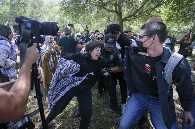 Israel-Hamas war protesters and police clash on Texas campus, Columbia University begins suspensions
