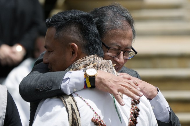 Colombia honors searchers and sniffer dog that helped find 4 children who survived plane crash