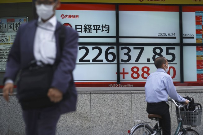 Stocks slide on Wall Street as new coronavirus cases surge