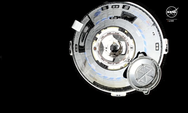 Boeing's astronaut capsule arrives at the space station after thruster trouble