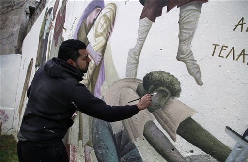 AP PHOTOS: Greek graffiti artists spray thoughts