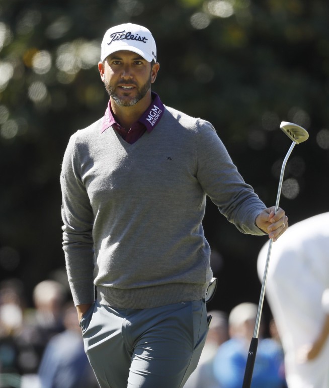 The Latest: Spieth duels with amateur DeChambeau for lead