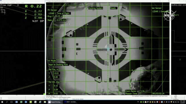 US-built capsule with a dummy aboard docks at space station