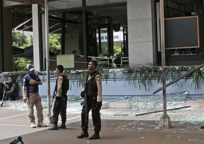 The Latest: Police say black IS flag was on Jakarta attacker