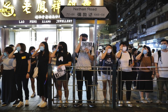 Hong Kong protesters form human chains to call for democracy