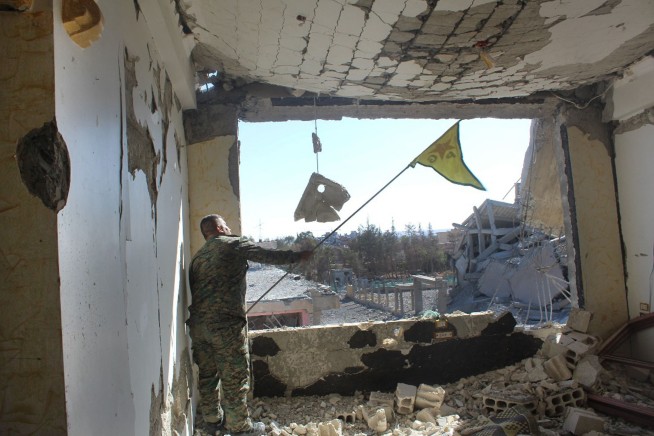 The Latest: Syrian Kurdish commander says Raqqa freed of IS