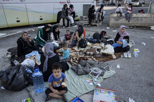 Hundreds of fleeing families sleep on beaches and streets after Israel's strikes shake Beirut