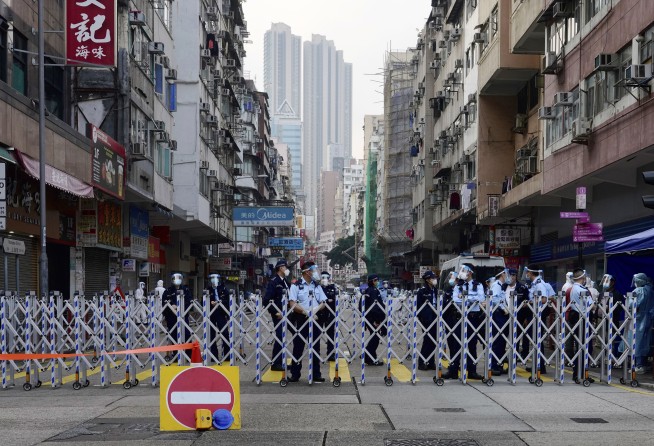 Thousands of Hong Kongers locked down to contain coronavirus