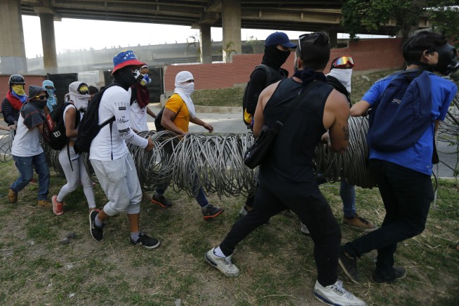 Venezuela threatens to exit OAS as pressure on Maduro mounts