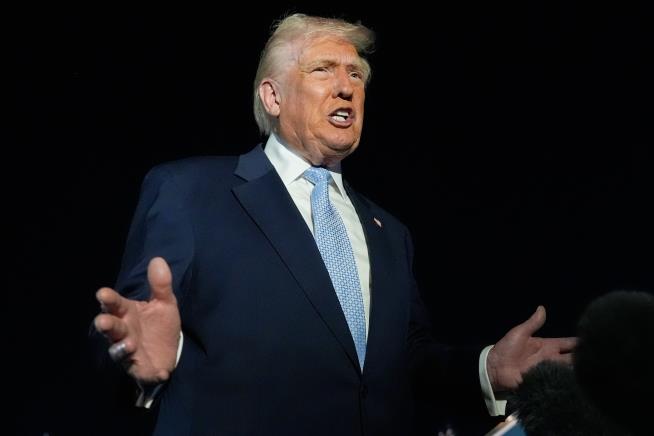 Trump defends Tucker Carlson after interview with activist known for his antisemitic views