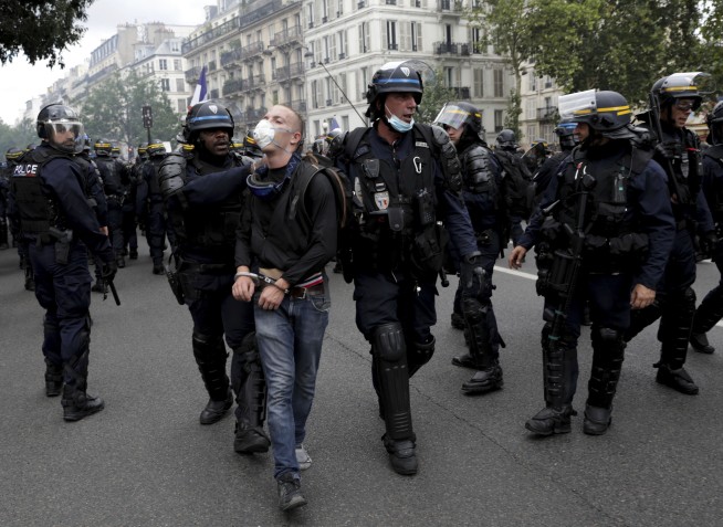 French police clash with anti-virus pass protesters in Paris