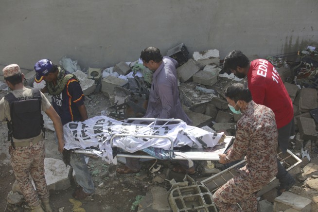 Pakistan jet with 98 aboard crashes in crowded neighborhood