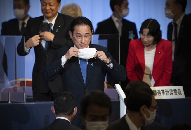 Ex-diplomat Kishida wins Japan party vote, to become new PM