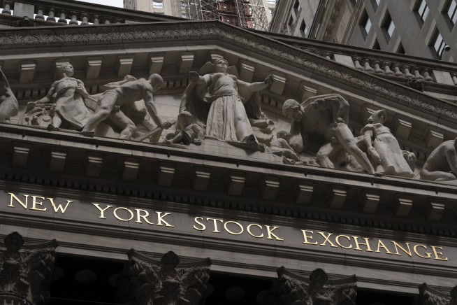 Stocks are mostly lower on Wall Street; AMC swings sharply