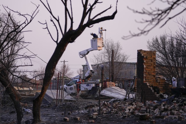 Wildfire grows into one of largest in Texas history as flames menace multiple small towns