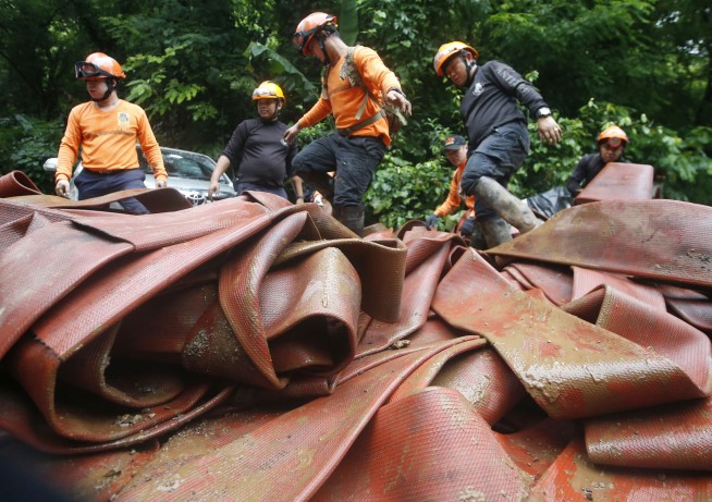 Thai rescuers search for other entrances to flooded cave