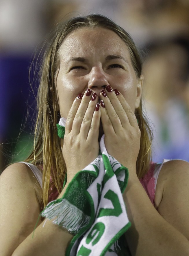 Hunt begins for cause of crash that wipes out Brazilian team