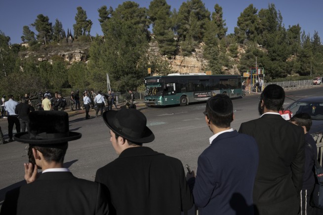 Twin blasts shake Jerusalem, killing teen and wounding 18