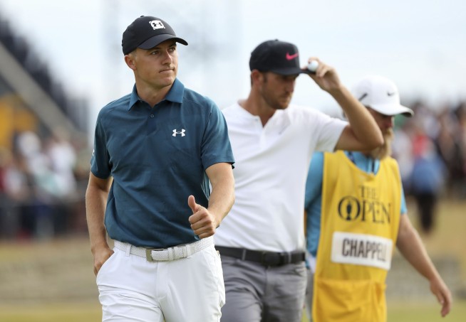 Molinari survives wild day to win British Open