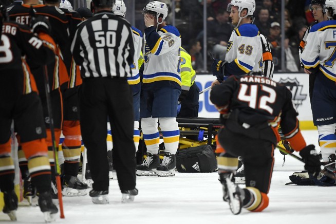 Blues' Bouwmeester remains hospitalized after bench collapse