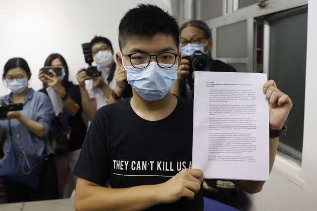 Hong Kong postpones elections by a year, citing coronavirus