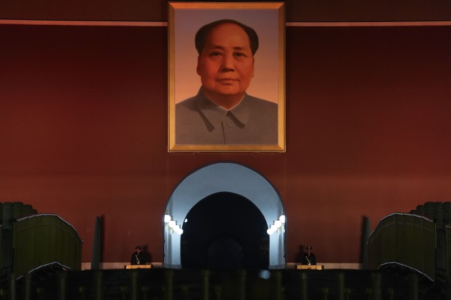 China sticks to an economic growth target of 'around 5%' despite a looming trade war with US