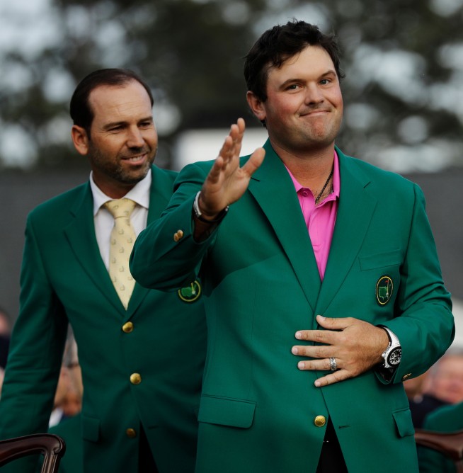 Reed wins first major title, holding off Fowler at Masters