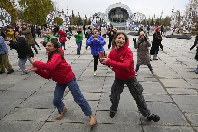 Russia opens a vast national exposition as presidential election approaches
