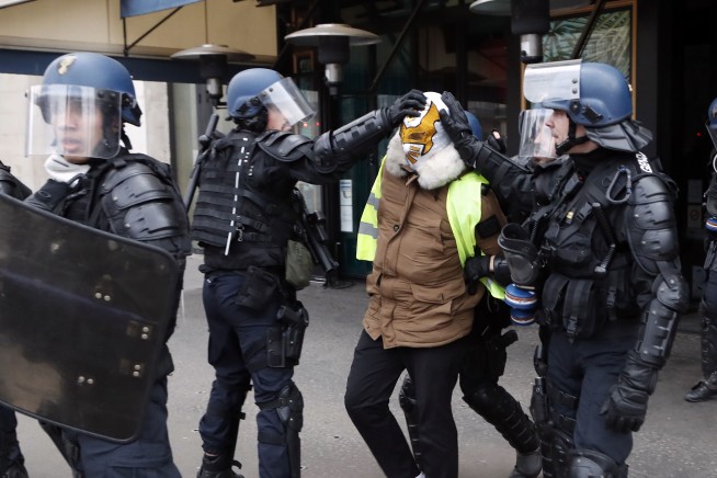 The Latest: France: 135 hurt in protests; 1,000 detained
