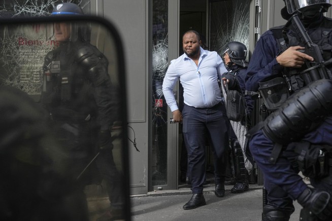 French activists protest racism and police brutality while officers are on guard for key events