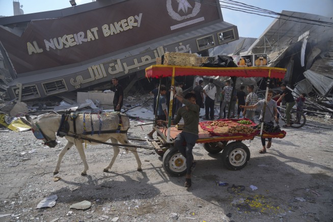 Live updates | Israel OKs limited aid for Gaza as regional tensions rise following hospital blast