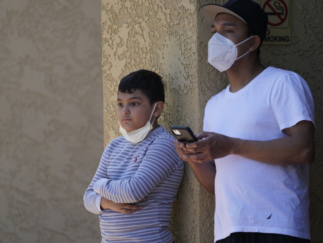 Mother arrested after 3 children found slain in Los Angeles