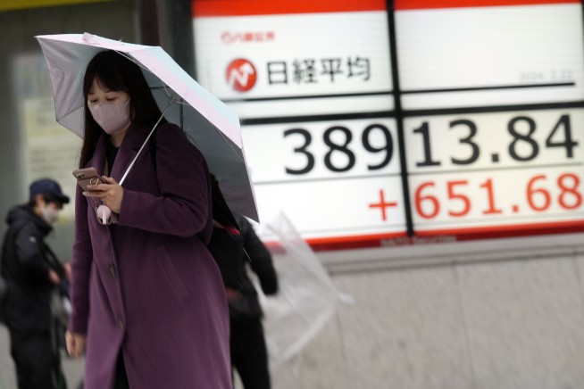 Stock market today: Japan's benchmark briefly reaches all-time high after rally on Wall Street